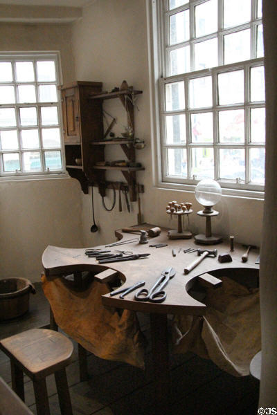 Goldsmith work table with leather to capture scrap gold at John Knox House. Edinburgh, Scotland.