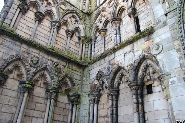 Holyrood Abbey wall with carved faces. Edinburgh, Scotland.