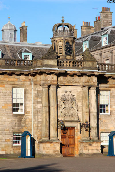 Holyrood Palace wing (1670s) built under Charles II with crowned clock tower over doorway. Edinburgh, Scotland.