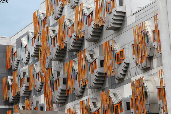 Abstract crow steps shape of traditional Scottish building gables behind staves on walls of Scottish Parliament. Edinburgh, Scotland.