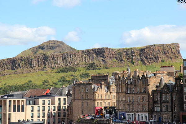 Salisbury Crags & Arthur's Seat over roofline of Edinburgh. Edinburgh, Scotland.