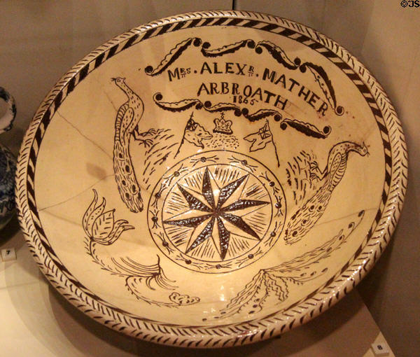 Redware sgraffito kitchen bowl inscribed Mrs. Alex Arbroath (1865) prob. by Dryley's Potter of Montrose at National Museum of Scotland. Edinburgh, Scotland.
