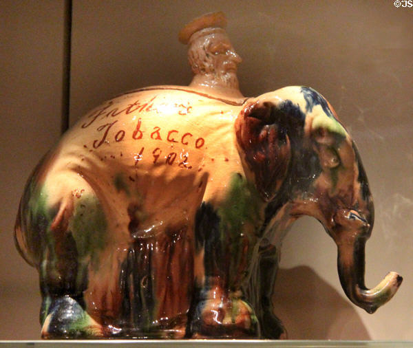 Ceramic elephant inscribed Gather's Tobacco (1902) by Seaton Pottery of Aberdeen at National Museum of Scotland. Edinburgh, Scotland.