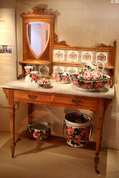 Tiled washstand (c1890) with Wemyss Ware toilet set (c1895) by Robert Heron's Fife Pottery of Kirkcaldy at National Museum of Scotland. Edinburgh, Scotland.