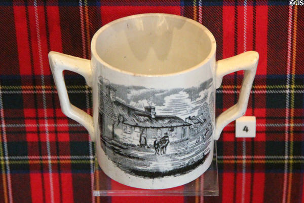 Robert Burns's Alloway cottage on earthenware cup by Clyde Pottery Co. Ltd. of Greenock at National Museum of Scotland. Edinburgh, Scotland.