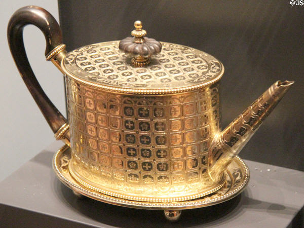 Silver gilt tea pot with heraldic symbols (1796-1820) from London at National Museum of Scotland. Edinburgh, Scotland.