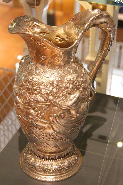 Metalwork water pitcher with waves, nymphs, shell & seaweed (c1891) by Tiffany & Co. of New York at National Museum of Scotland. Edinburgh, Scotland.
