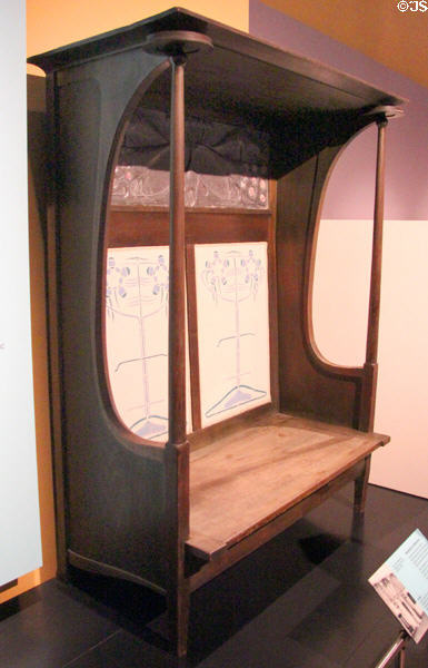 Settle (1895) by Charles Rennie Mackintosh with panel by Margaret Mackintosh made by J&W Guthrie of Glasgow at National Museum of Scotland. Edinburgh, Scotland.