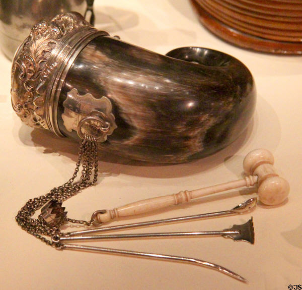 Ram's horn snuff mull with snuff-taking implements on chains at National Museum of Scotland. Edinburgh, Scotland.