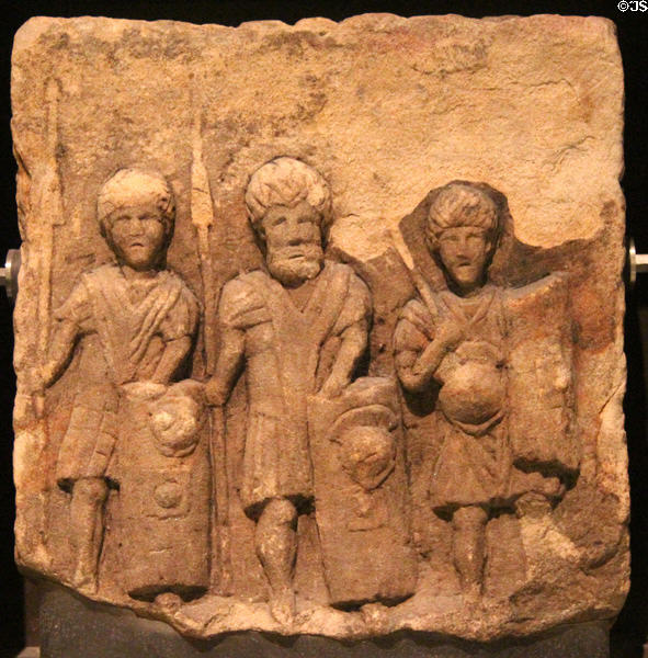 Stone slab carved with Roman soldiers (c150 CE) as seen by native Scots at National Museum of Scotland. Edinburgh, Scotland.