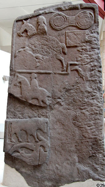 Pictish stone carved with horsemen & typical double disk symbol at National Museum of Scotland. Edinburgh, Scotland.