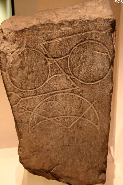 Carved stone with double-discs & crescent Pictish symbols from Fiscavaig at National Museum of Scotland. Edinburgh, Scotland.