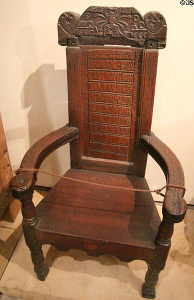 Oak armchair with coat of arms of Sir William Douglas of Glenbervie (1665) Scottish made at National Museum of Scotland. Edinburgh, Scotland.