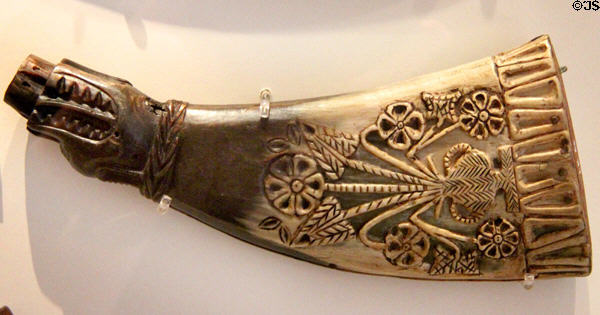 Scottish decorated powder horn with pot of lilies & double headed eagle emblem of Perth (late 16th - early 17thC) at National Museum of Scotland. Edinburgh, Scotland.