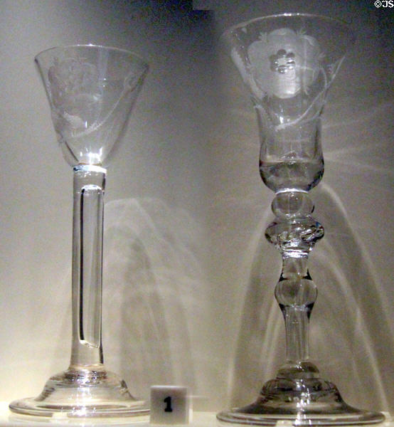 Wine glasses engraved with six petal rose & single bud Jacobite symbol (1740-50) which would be considered treasonous to British crown at National Museum of Scotland. Edinburgh, Scotland.