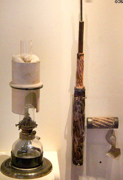 Oil lamp to light microscope (1866) used while laying Transatlantic Cable & sample of Transatlantic submarine cable at National Museum of Scotland. Edinburgh, Scotland.