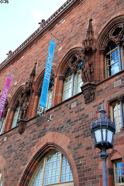 Sculpted figures between windows on facade of National Portrait Gallery of Scotland. Edinburgh, Scotland.