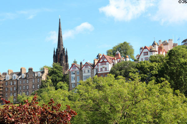 The Hub (originally Church of Scotland) above heritage residential buildings of Old Town seen from Princes Street Gardens. Edinburgh, Scotland.