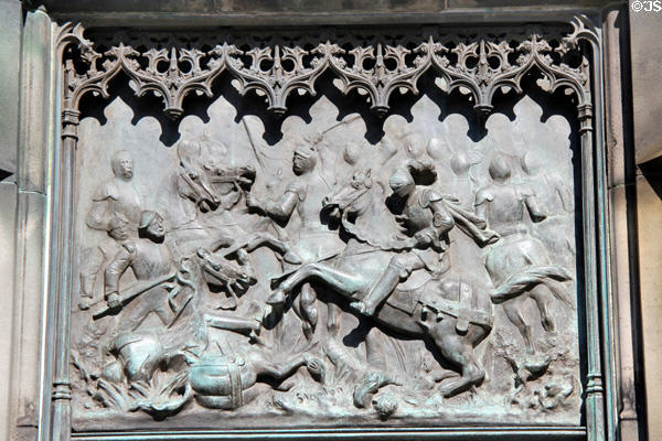 Mounted knights in battle relief panel (1887) by William Birnie Rhind on Duke of Buccleuch statue. Edinburgh, Scotland.