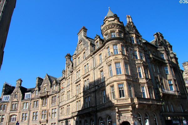 Scots Baronial corner tenement (former bank) (1892-3) (Royal Mile curving onto Cockburn St.). Edinburgh, Scotland. Architect: John MacLachlan.