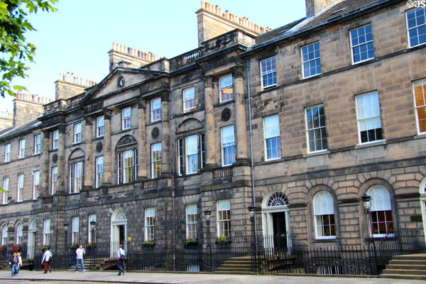 Row houses which combine into neo-classical palace facade (designed 1791; built 1803-10) on Charlotte Square. Edinburgh, Scotland. Architect: Robert Adam.