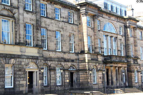Row houses which combine into neo-classical palace facade (designed 1791; built 1803-10) on Charlotte Square. Edinburgh, Scotland. Architect: Robert Adam.