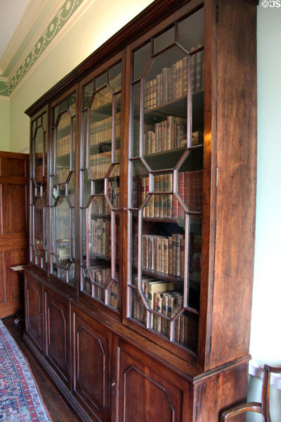 Glass fronted mahogany bookcase (late 18thC) in parlour at Georgian House museum. Edinburgh, Scotland.