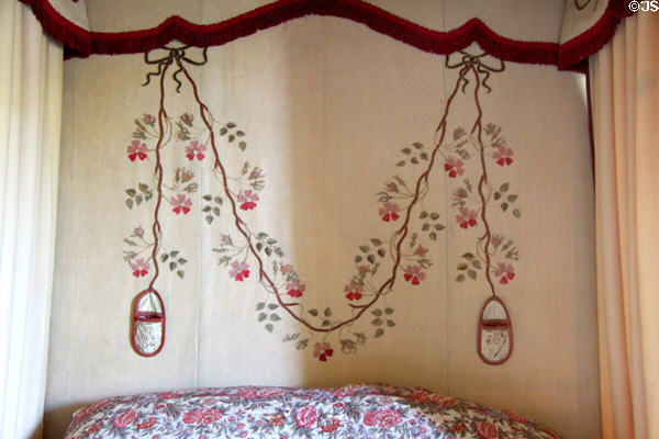 Details of four poster bed embroidered hangings (1774) with slipper like pockets for holding small objects in bedchamber at Georgian House museum. Edinburgh, Scotland.
