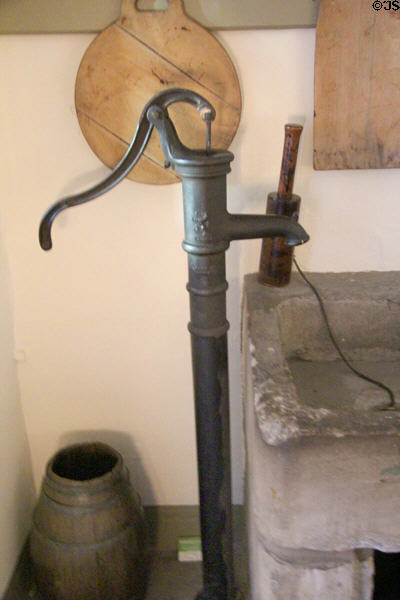 Water pump with curved pump handle in kitchen at Georgian House museum. Edinburgh, Scotland.