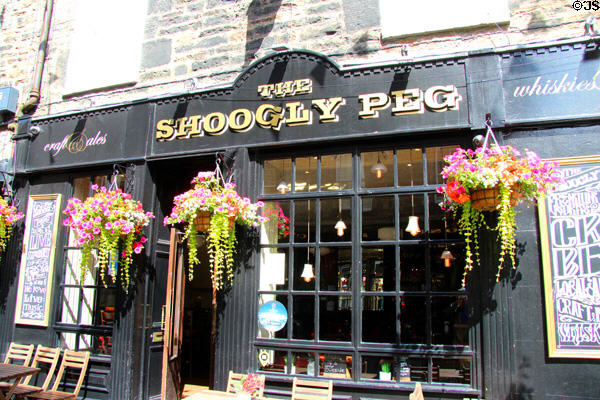 Flowers on Shoogly Peg pub on Rose Street. Edinburgh, Scotland.