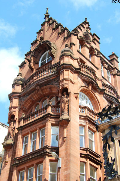 Red sandstone commercial building with sculptures (1894-6) (60-62 Buchanan St. Mall). Glasgow, Scotland.