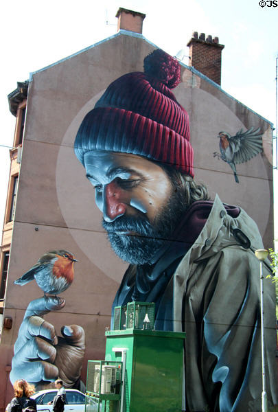 Mural of Saint with birds on end of Bell o'the Brae Tenements (on High St.). Glasgow, Scotland.