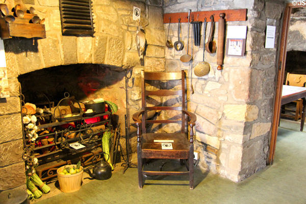 Cooking fireplace & armchair at Provand's Lordship. Glasgow, Scotland.