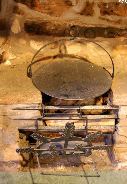 Scottish antique hanging iron girdle (griddle) for bannock bread at Provand's Lordship. Glasgow, Scotland.