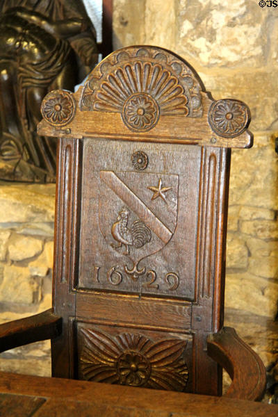 Scottish oak great chair (1629) carved with crest of star & chicken at Provand's Lordship. Glasgow, Scotland.