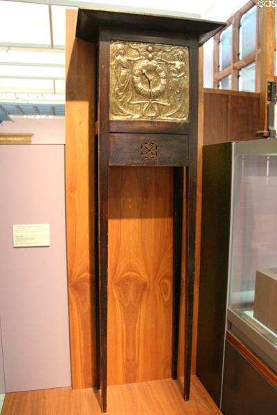 Glasgow-style Art Nouveau tall clock (1900) with brass face by Margaret Thomson Wilson at Kelvingrove Art Gallery. Glasgow, Scotland.
