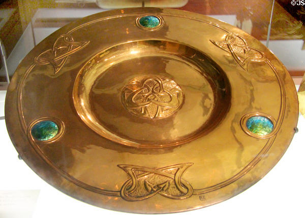Brass alms dish (c1900) by Margaret Gilmour of Glasgow at Kelvingrove Art Gallery. Glasgow, Scotland.