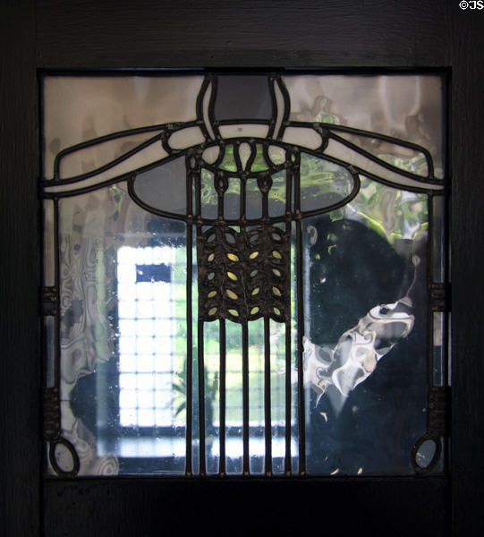 Hall stained glass window in style of Charles Rennie Mackintosh at House for an Art Lover. Glasgow, Scotland.