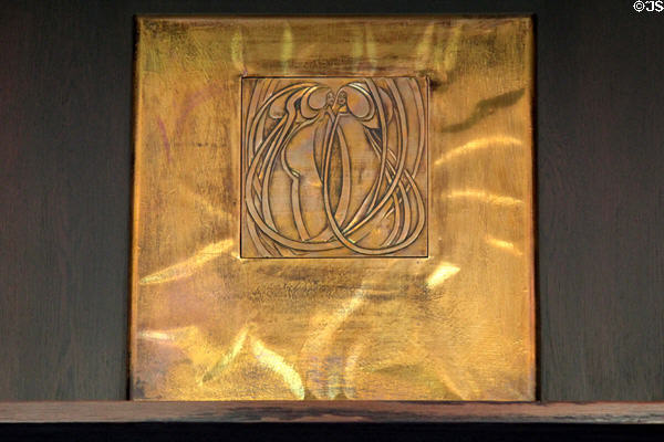 Margaret Macdonald-style brass plaque on dining room sideboard at House for an Art Lover. Glasgow, Scotland.