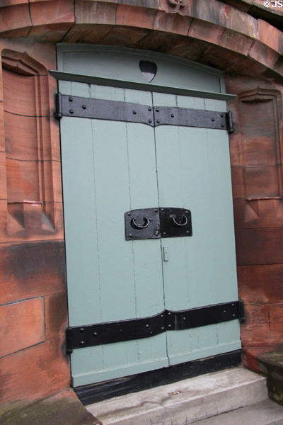 Door with slightly curved hardware typical of architect at Mackintosh Church. Glasgow, Scotland.