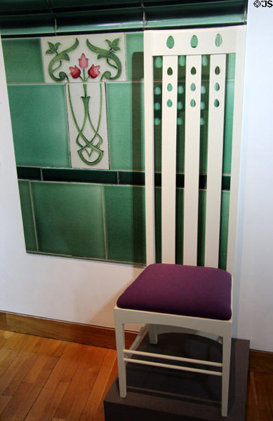 House for an Art Lover music room high-back chair (1901) by Charles Rennie Mackintosh at The Lighthouse. Glasgow, Scotland.