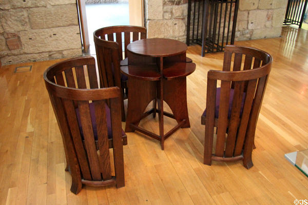 Round-back chairs & round two-level domino table (c1907) by Charles Rennie Mackintosh for Miss Cranston's Tearooms at The Lighthouse. Glasgow, Scotland.
