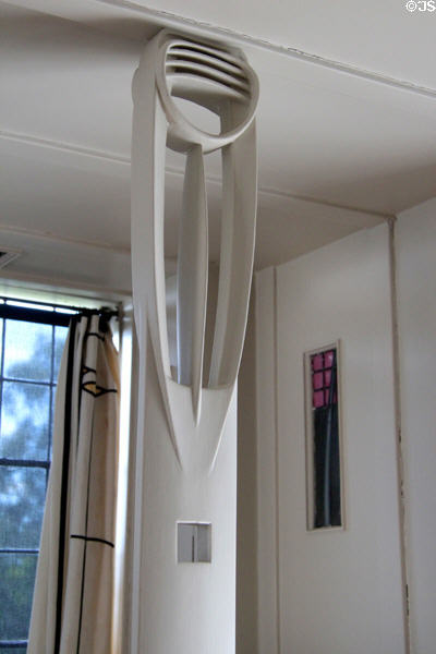 Window seat pole with petal-shape designs by C.R. Mackintosh in drawing room at Hill House. Helensburgh, Scotland.