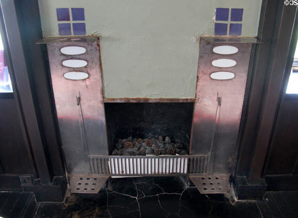 Dining room fireplace metal coal firebox with built-on trivets for kettles (1904) by C.R. Mackintosh at Hill House. Helensburgh, Scotland.