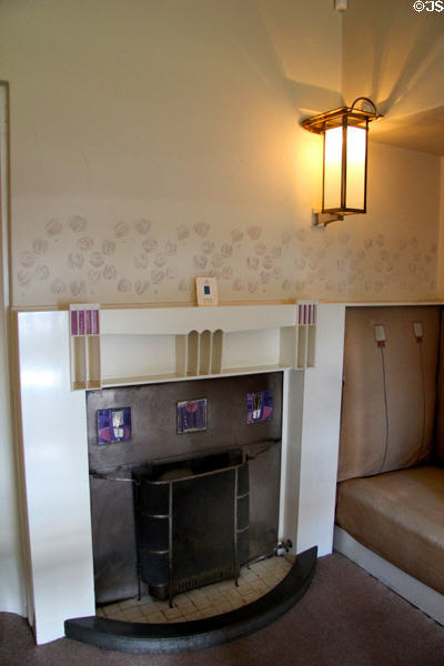 Fireplace with tile squares & cubbyholes in main bedroom at Hill House. Helensburgh, Scotland.