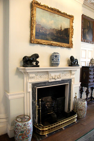 Central hall fireplace with Chinese works at Pollok House. Glasgow, Scotland.