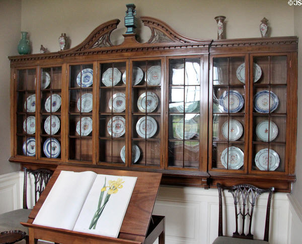 Hanging shelves with Chinese plates in print room at Pollok House. Glasgow, Scotland.