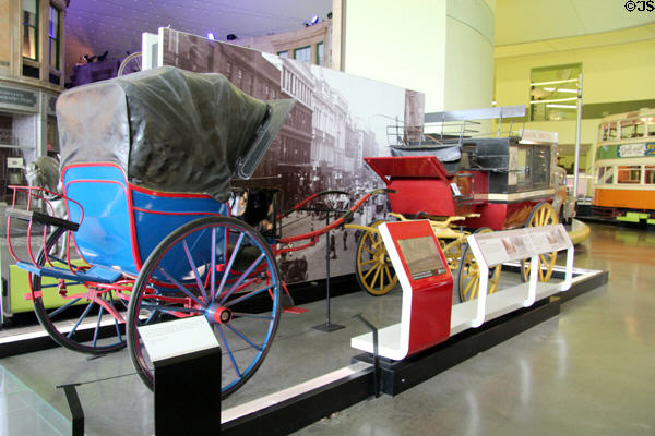 Cabriolet (c1910) & station bus wagons at Riverside Museum. Glasgow, Scotland.