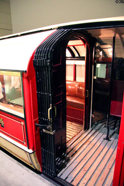 Subway carriage from when all stations had central platforms (1896-1977) so doors were only on one side & other side of train was unpainted at Riverside Museum. Glasgow, Scotland.
