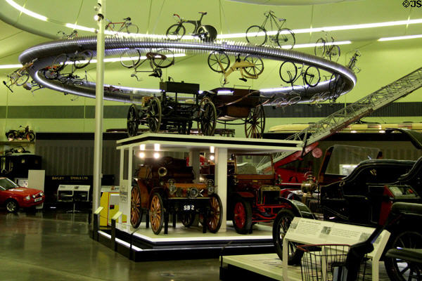 Display of bicycles above autos at Riverside Museum. Glasgow, Scotland.